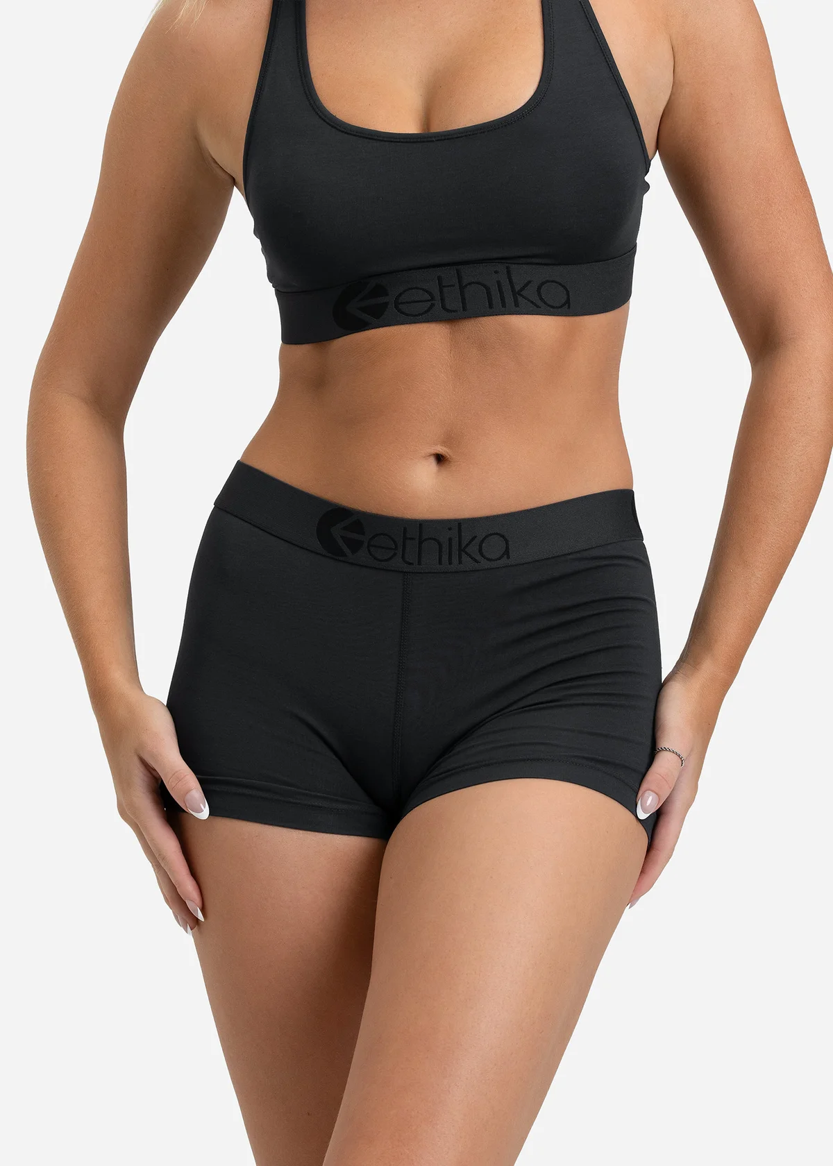 Ethika Basalt women’s boyshort and coordinating black bra on a model