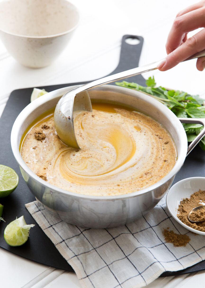 stirring creamy pumpkin soup