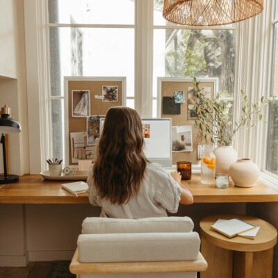 camille Styles working at desk