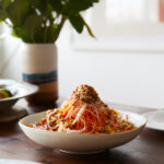 raw carrot salad with dates walnuts and aleppo