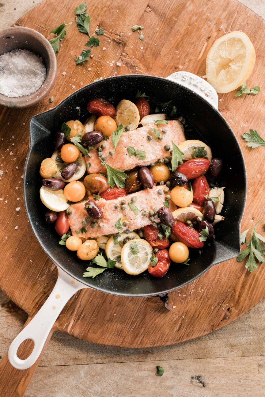 mediterranean baked salmon in cast iron pan