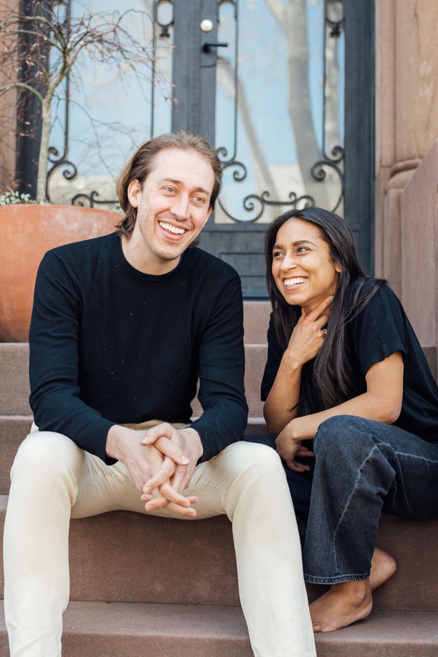 Long-distance couple laughing together.