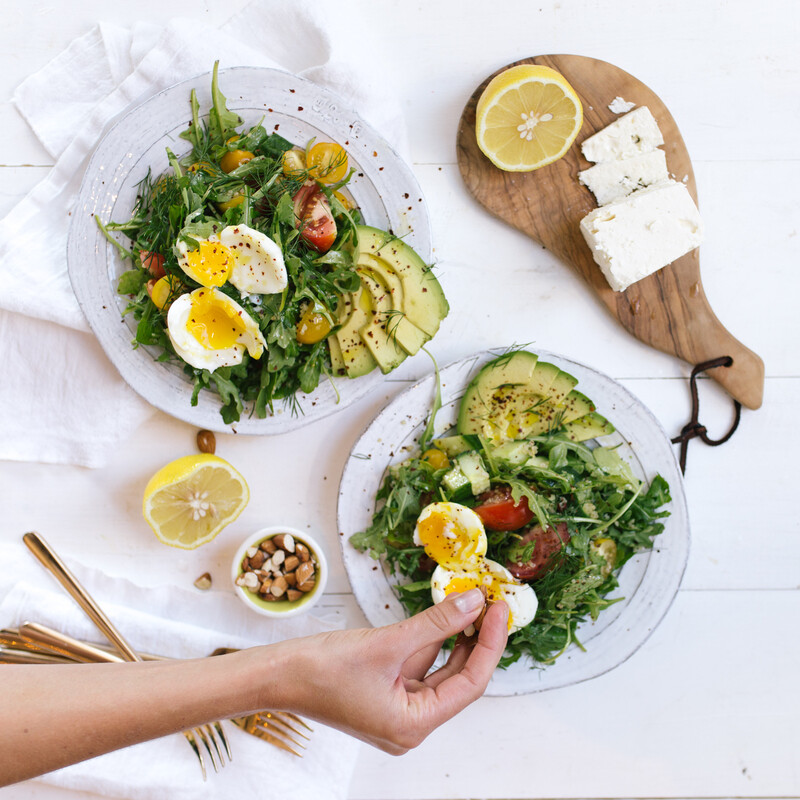 salads topped with soft boiled eggs