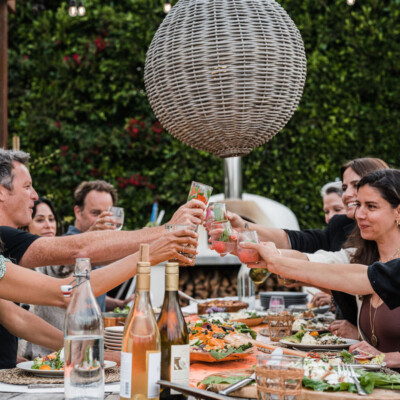 cheers - toast with wine - summer dinner party, fresh veggies, helene henderson -malibu farm