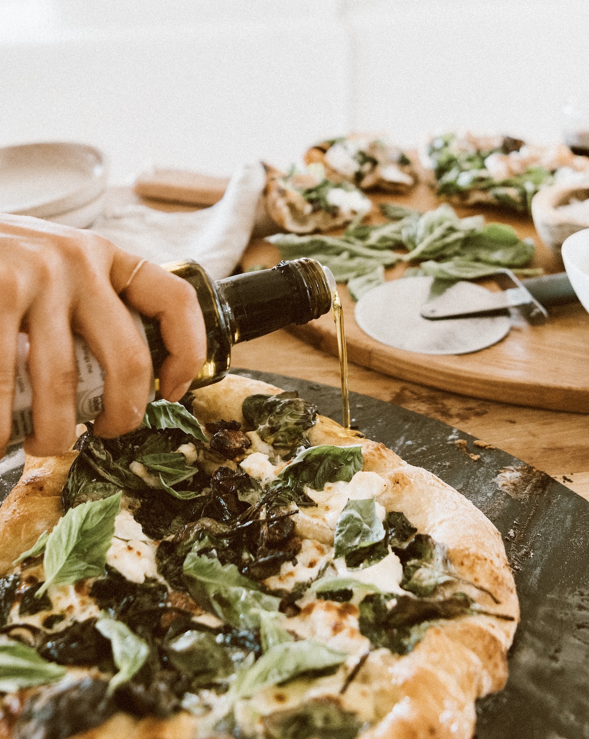 Camille Styles spinach and ricotta homemade pizza recipe baked in oven on pizza stone