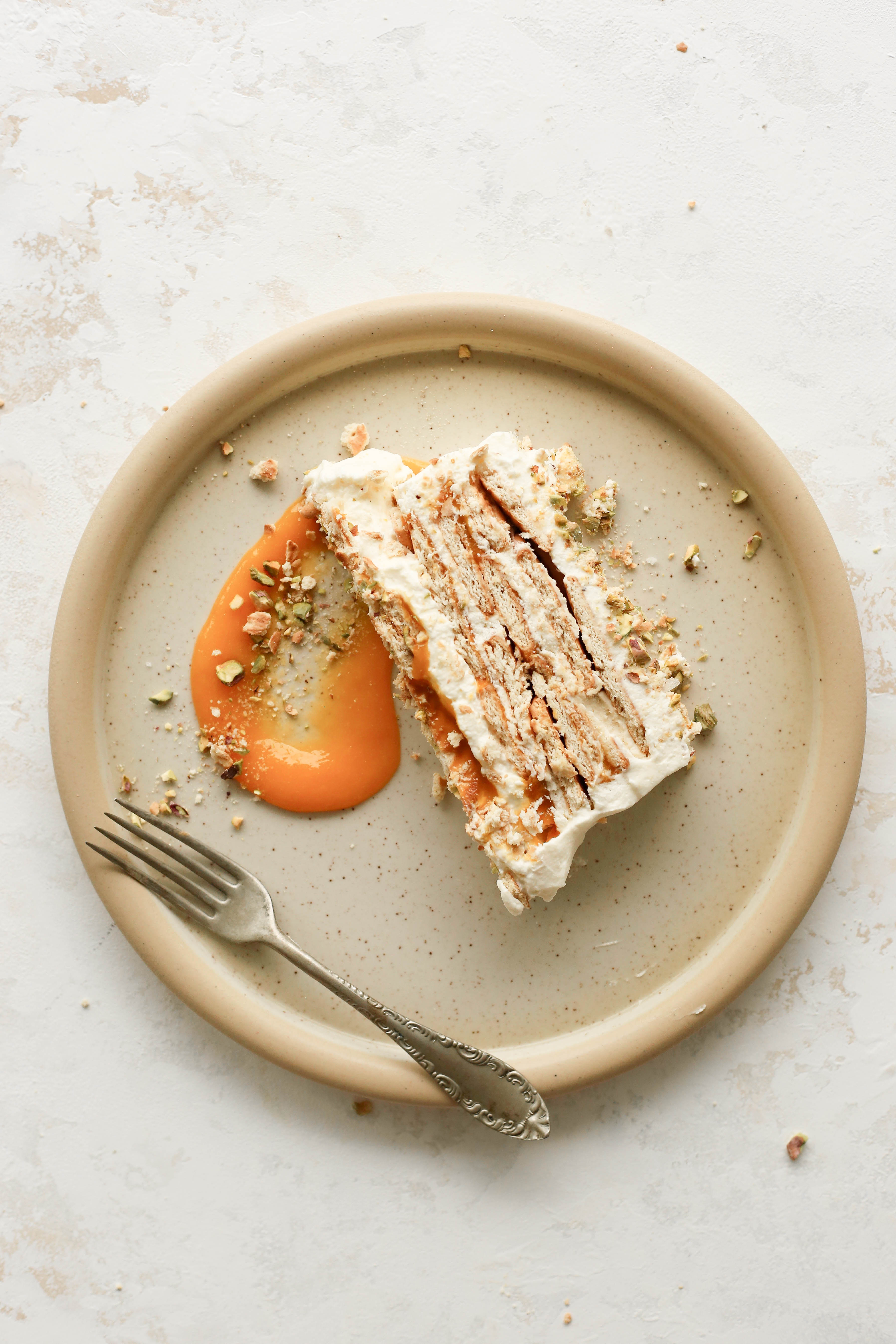 celebrate summer with this no bake mango and cardamom cream icebox cake with a salty pistachio crumble