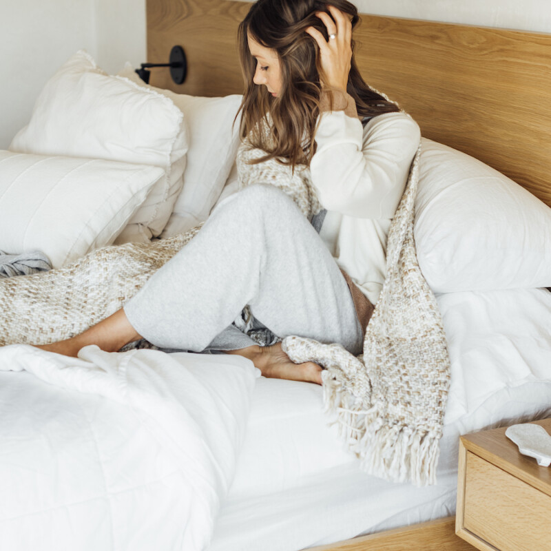 camille in bed, blanket, sheets, bedroom, rest, sleep