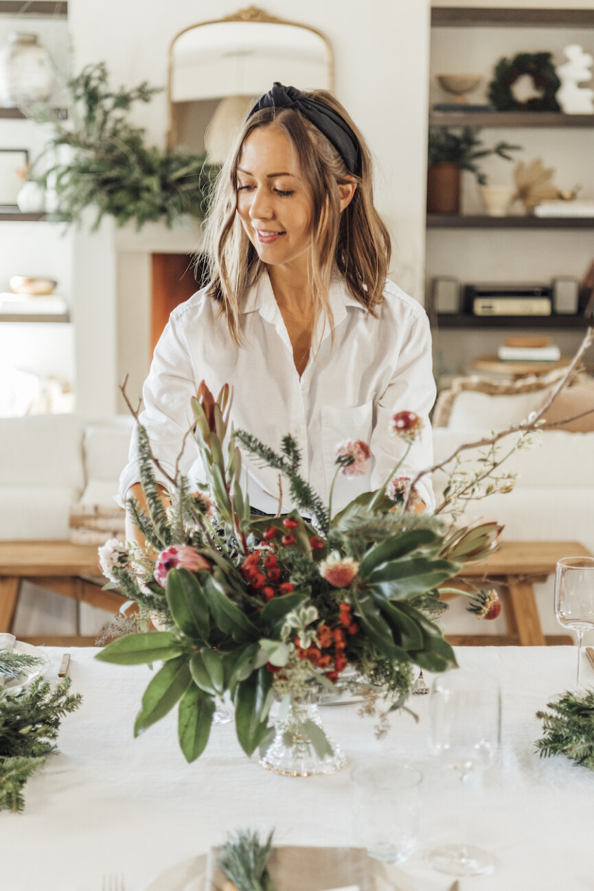 simple christmas table setting ideas-scandinavian inspired holiday tabletop with evergreen and pomegranates-camille setting table