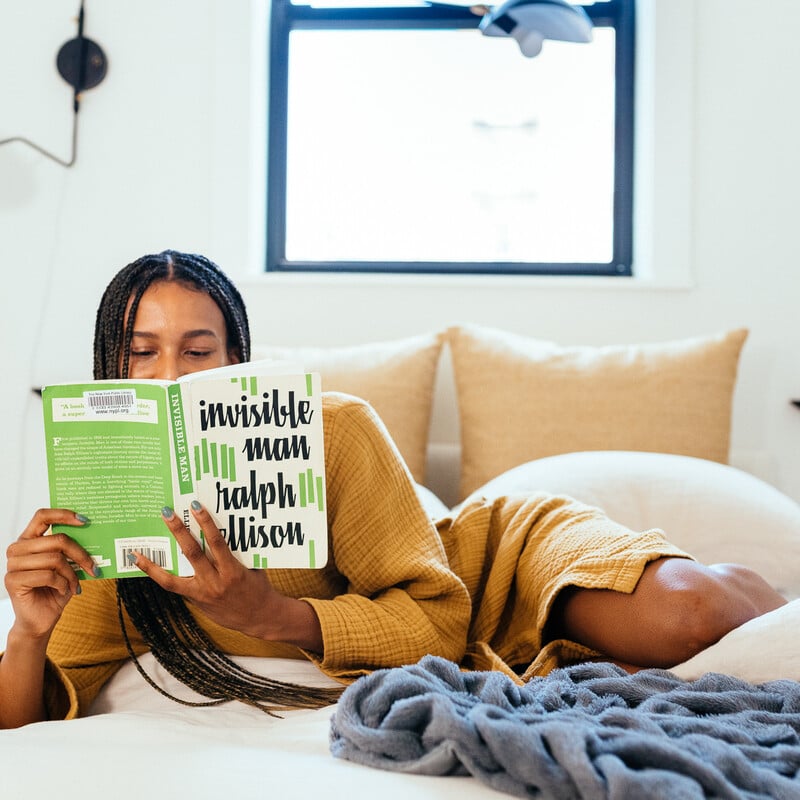 bipoc reading book novel cozy sunny bed_holiday social media detox