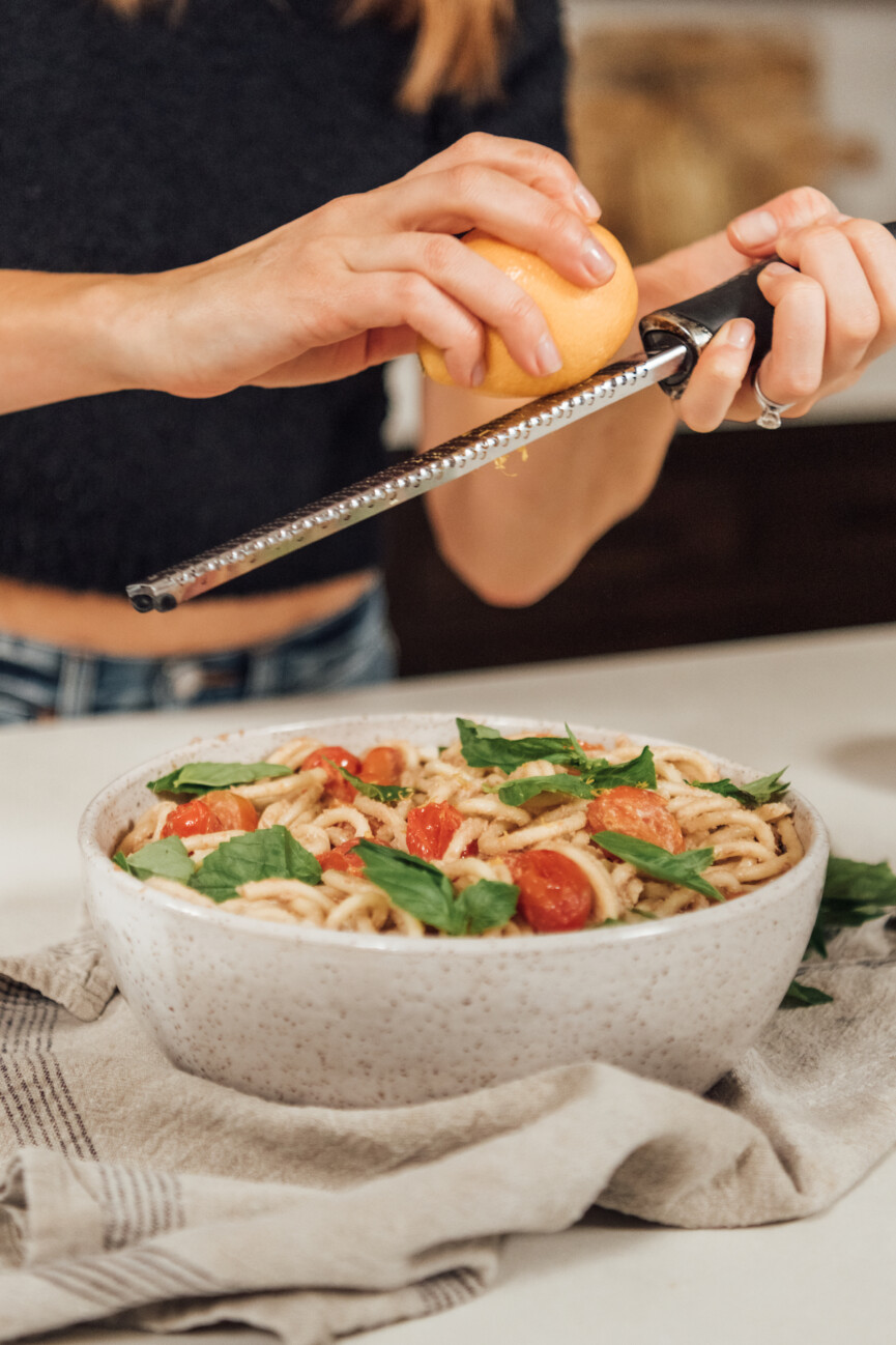 creamy vegan bucatini pasta with roasted tomatoes and basil