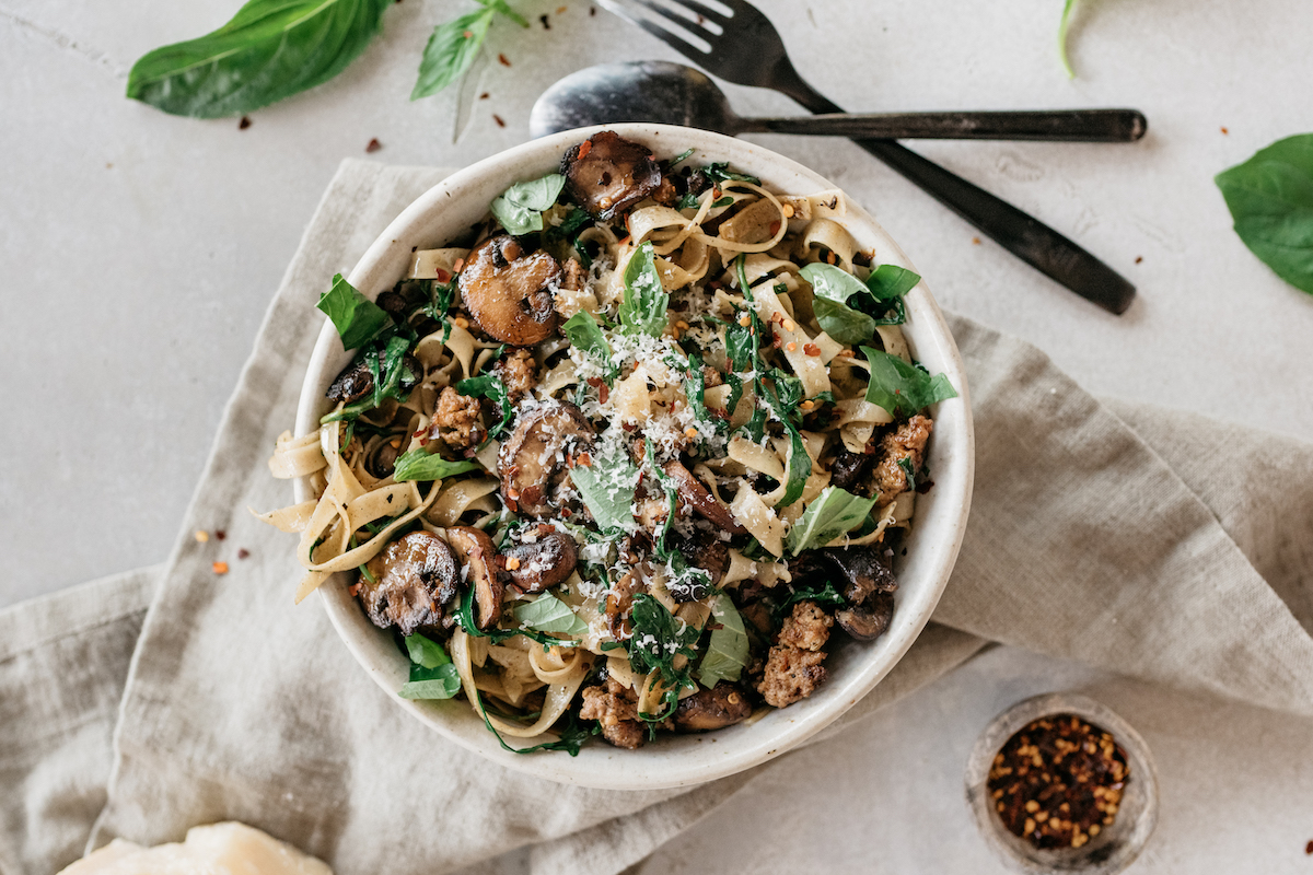one pot sausage pasta recipe with mushrooms, and arugula