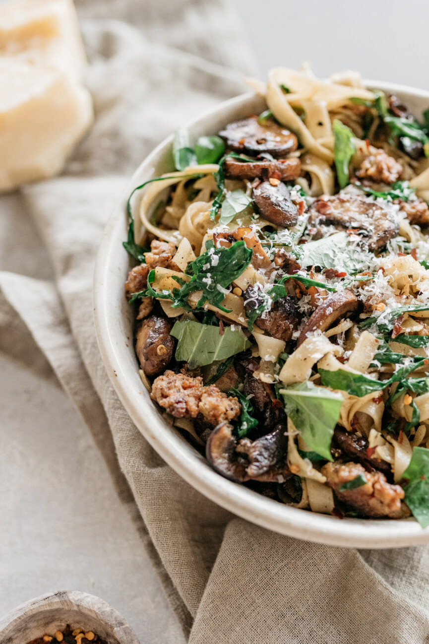 one pot sausage pasta recipe with mushrooms, and arugula