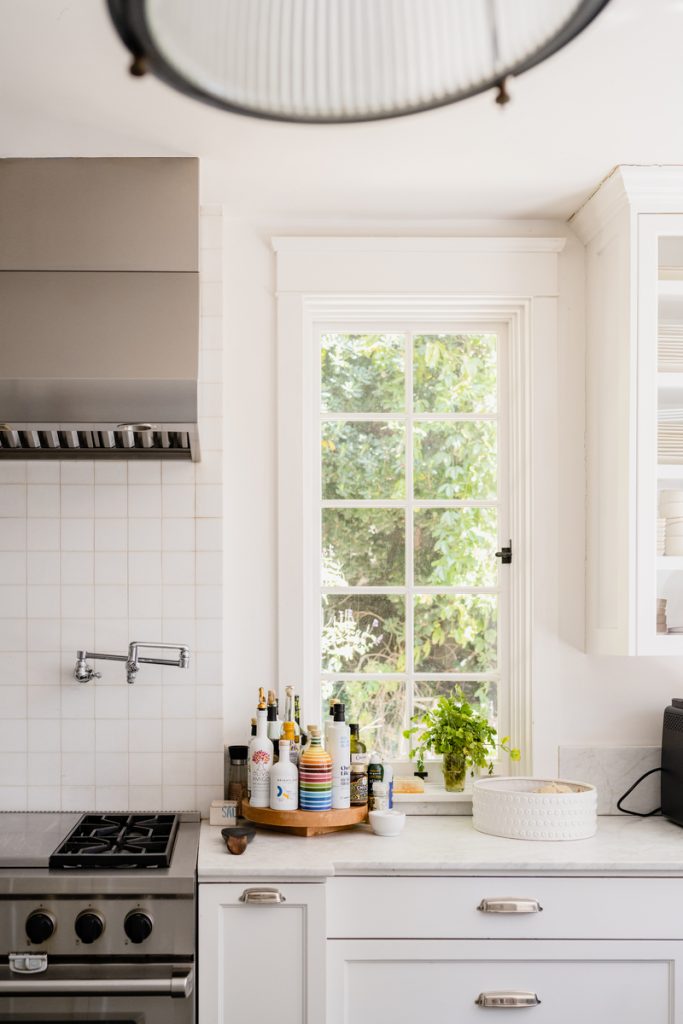 Teal Thomsen photography, olive oil, lazy susan, white kitchen, marble countertop_how to organize a junk drawer
