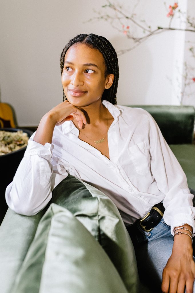brighten skin woman sitting couch