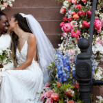bride and groom amidst flowers