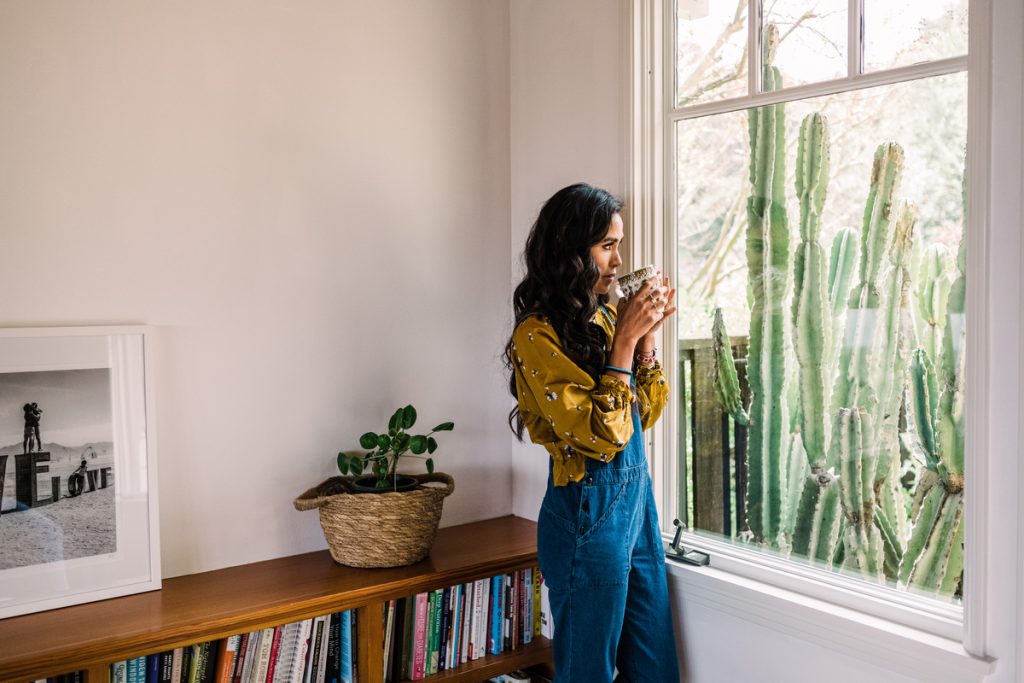 Contemplative woman sipping tea or coffee