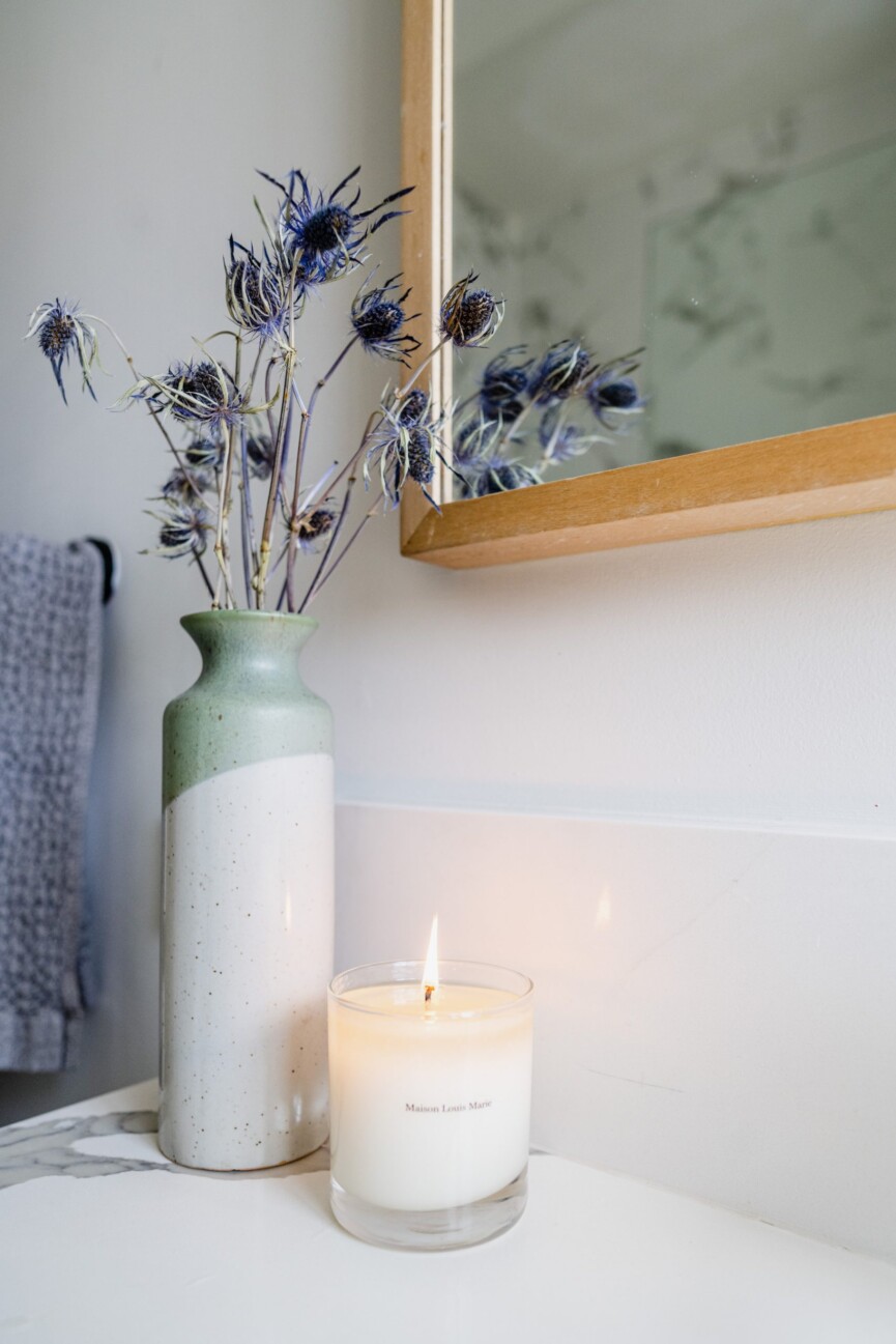 lit candle and vase