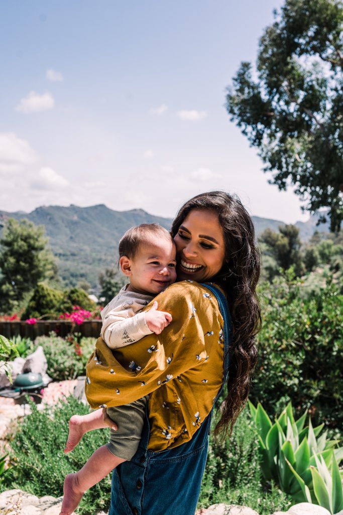 Kimberly Snyder playing with her baby outside_last-minute Mother's Day gifts