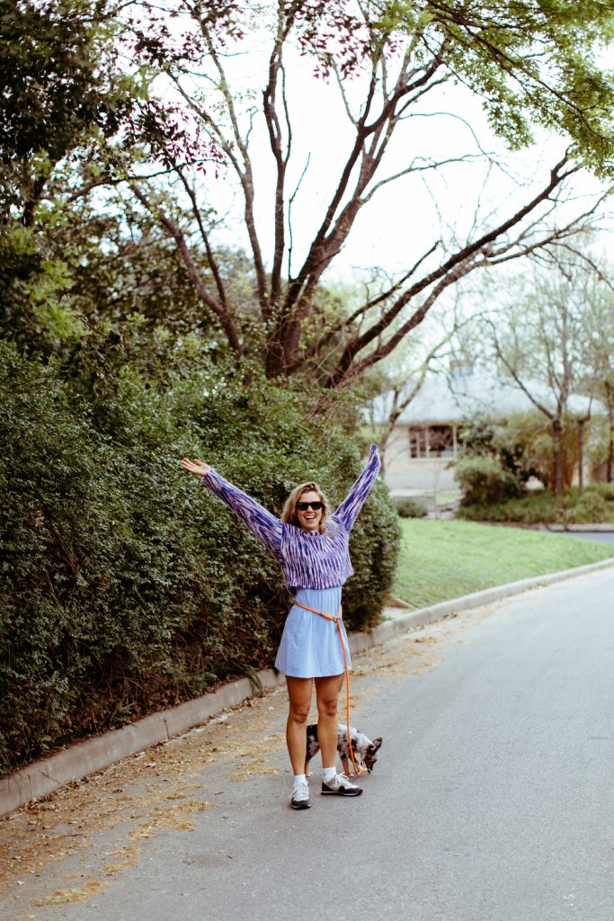 Ty Haney walking her dog_strength training benefits