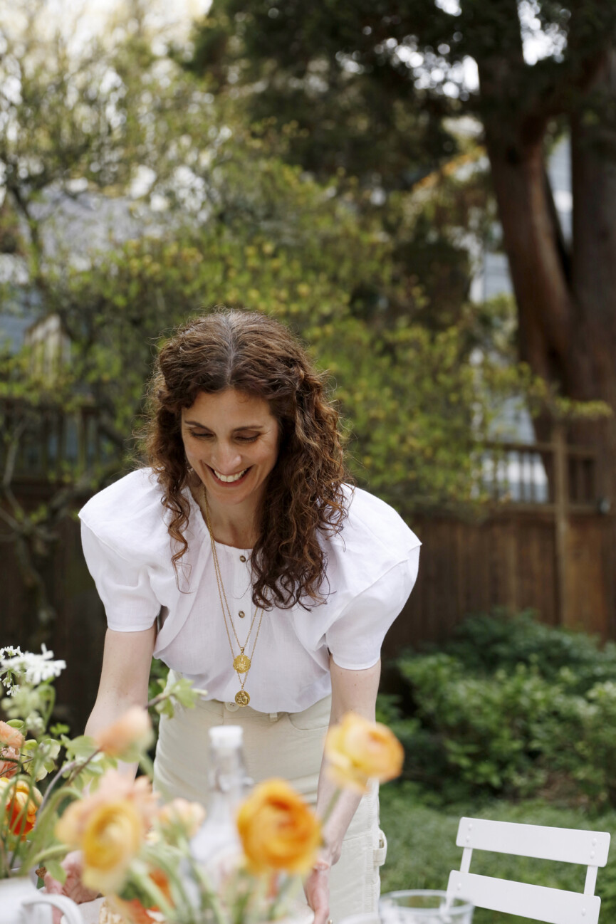 Aran Goyoaga setting the table for an outdoor party, flowers, tulips