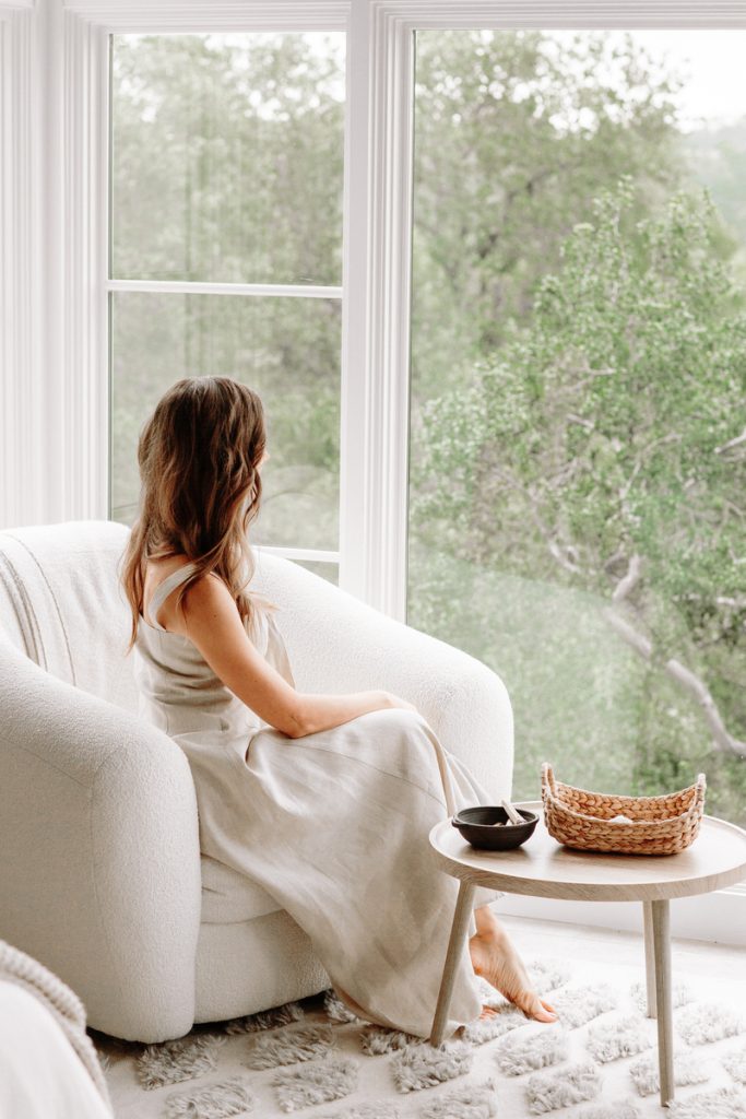 woman staring pensively out window_breath technique