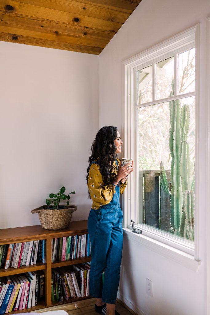 Kimberly Snyder drinking tea while contemplatively looking out the window_what is HRV