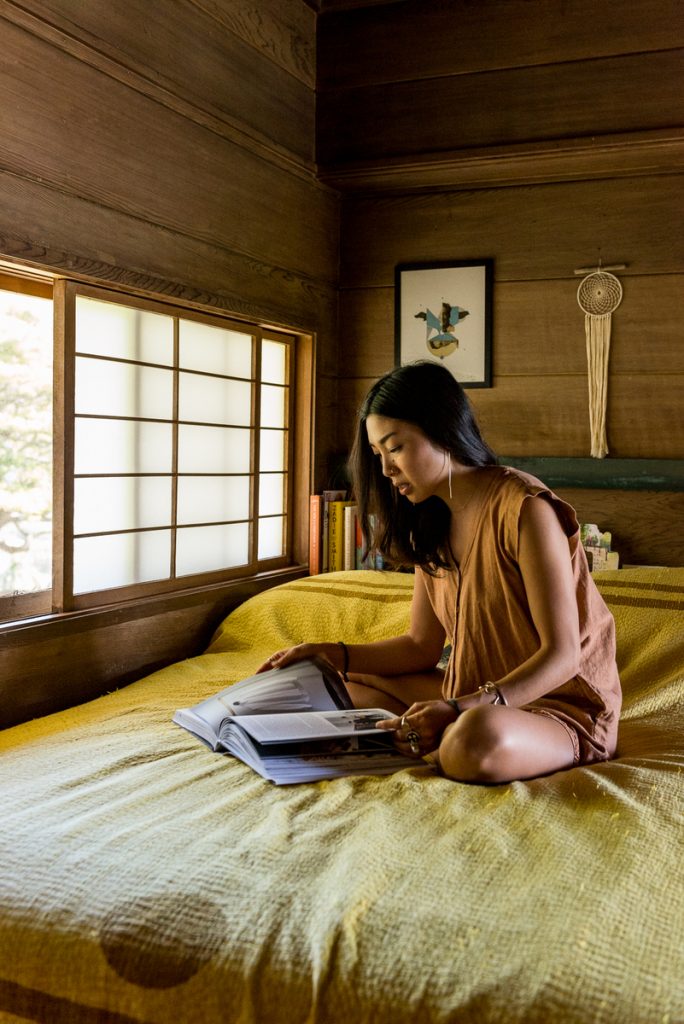 Jordan Higa reading book on bed_mindfulness for sleep