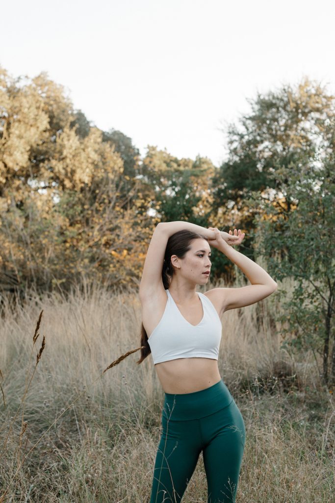 woman stretching outdoors_strength training benefits
