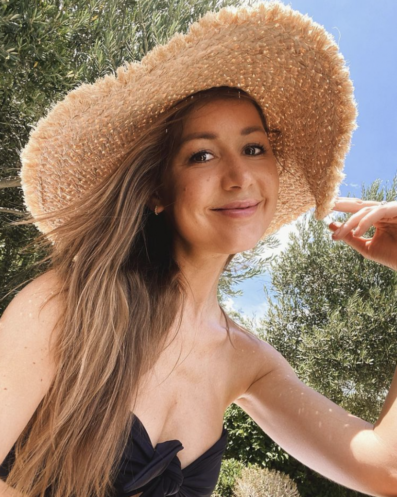 Camille Styles wearing sun hat_how to repair sun-damaged skin