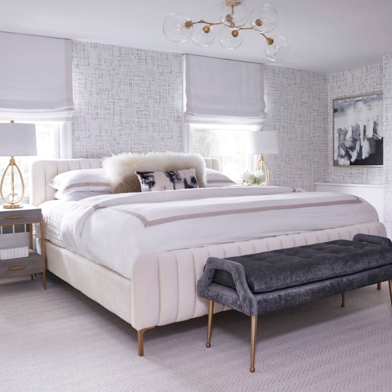 light gray bedroom with stool