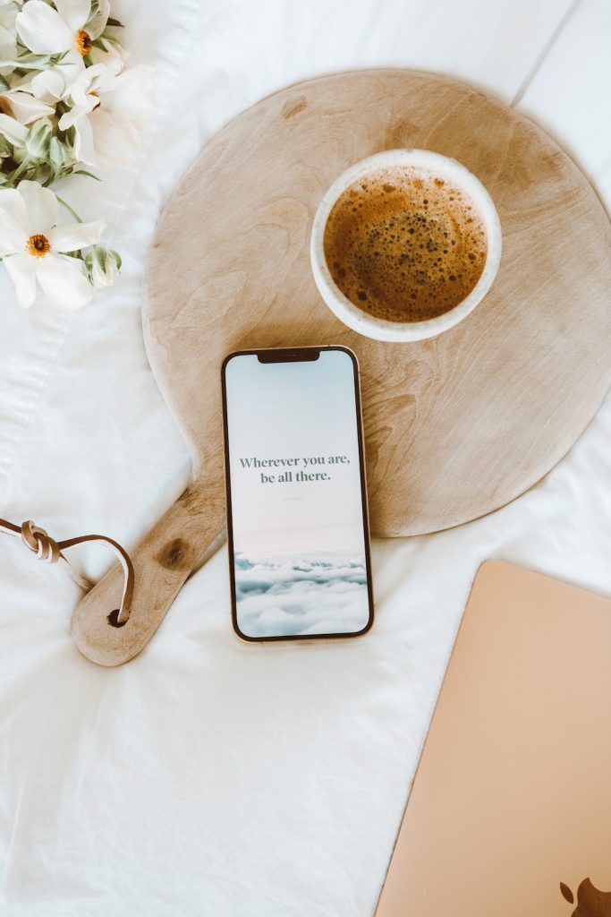motivational phone screen background with coffee and flowers