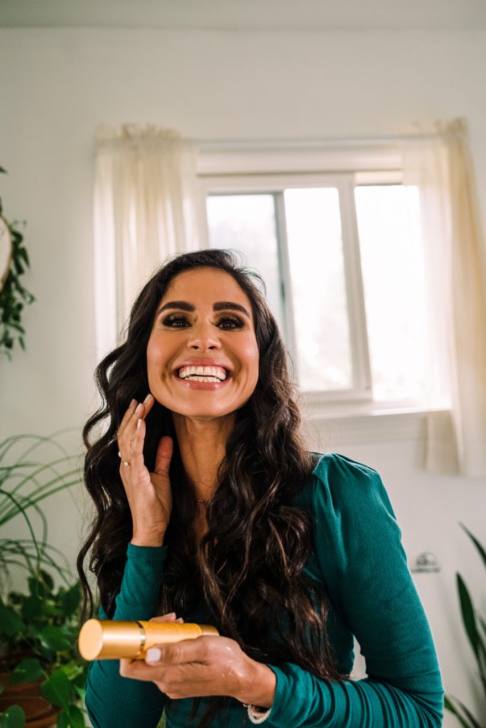 Kimberly Snyder applying skincare