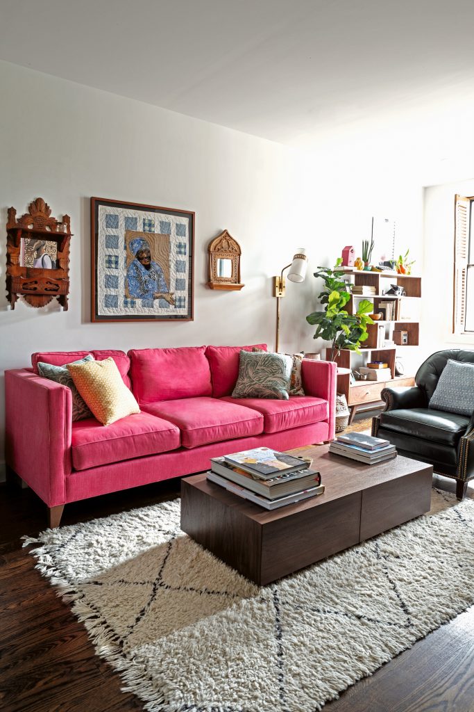 Vibrant living room with red couch.