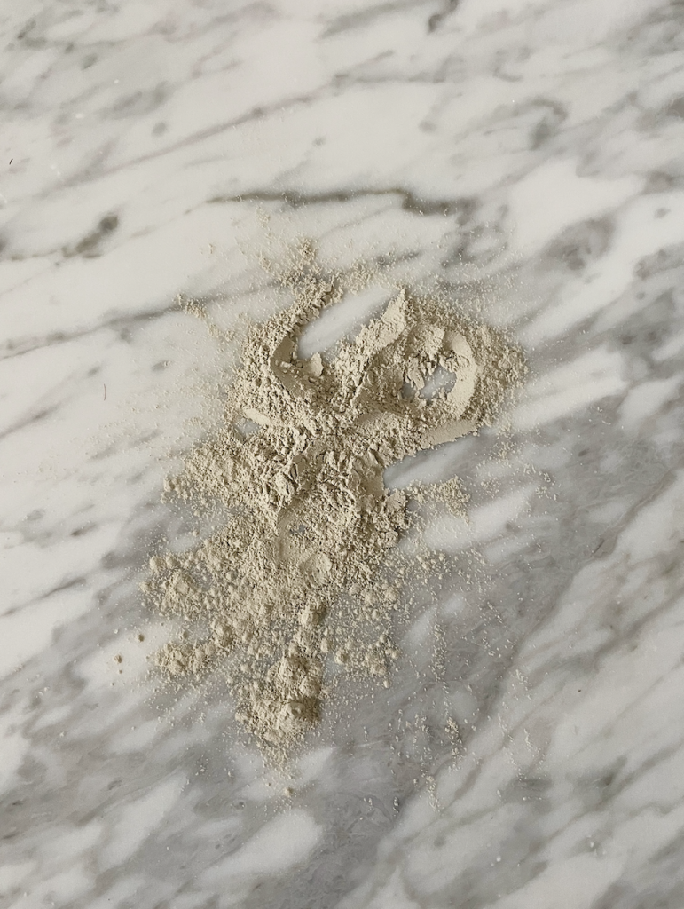 a clay mask on marble countertop
