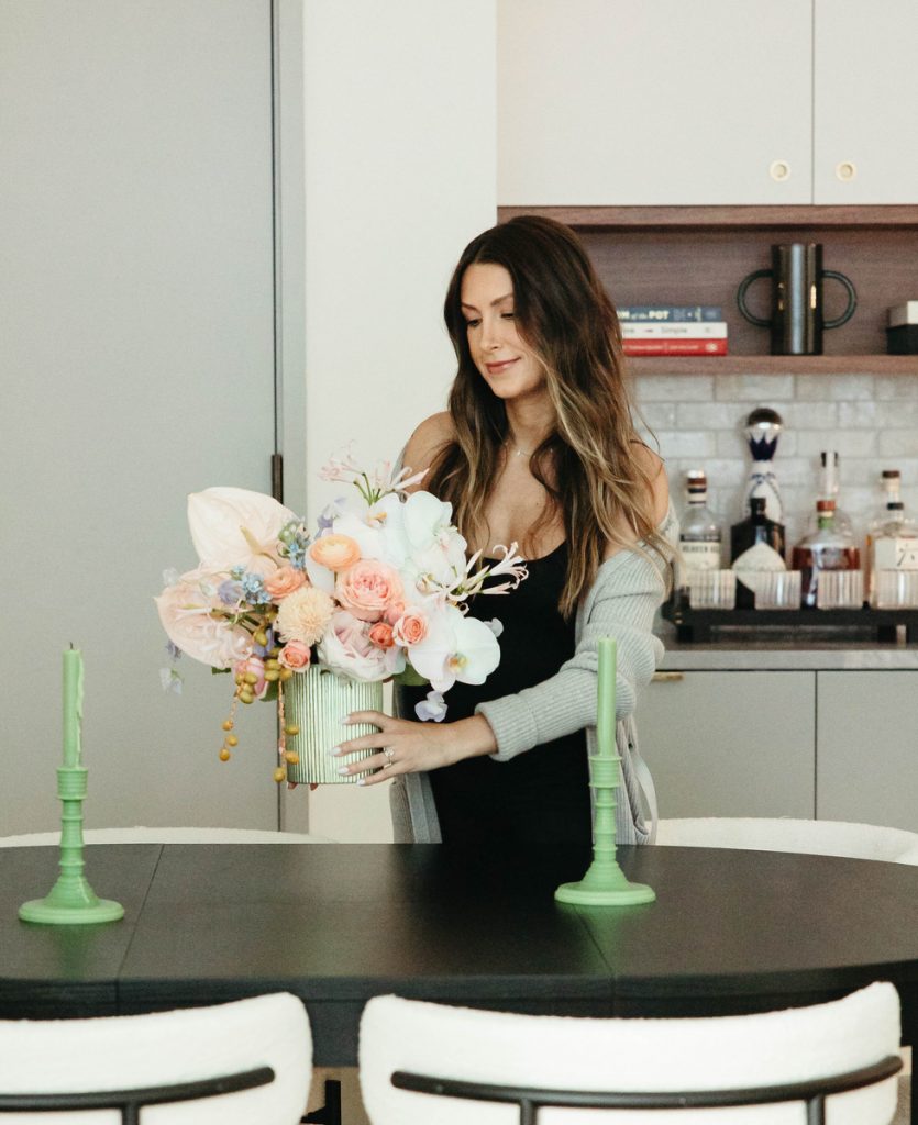 Roxana Saidi arranging flowers_how to build community