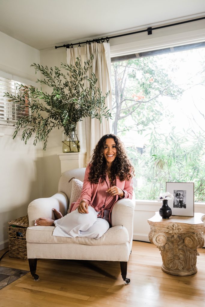 Simone Boyce smiling in living room at home