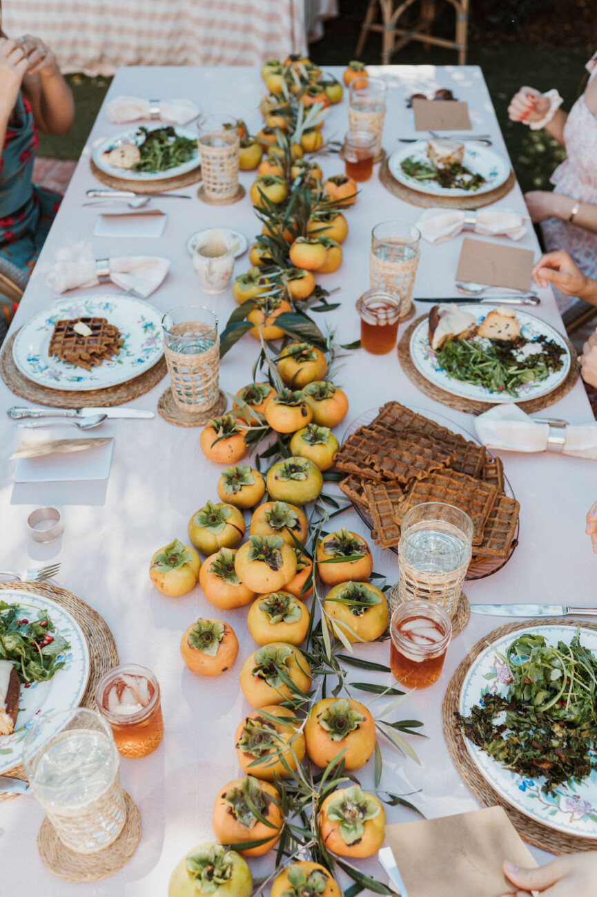 Laurel Gallucci, Sweet Laurel founder, Friendsgiving Brunch at Home in Los Angeles, backyard dinner party table, spring, persimmons