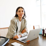 Woman at desk co-worker gift ideas_cycle syncing planner