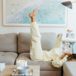 Woman reading on couch.