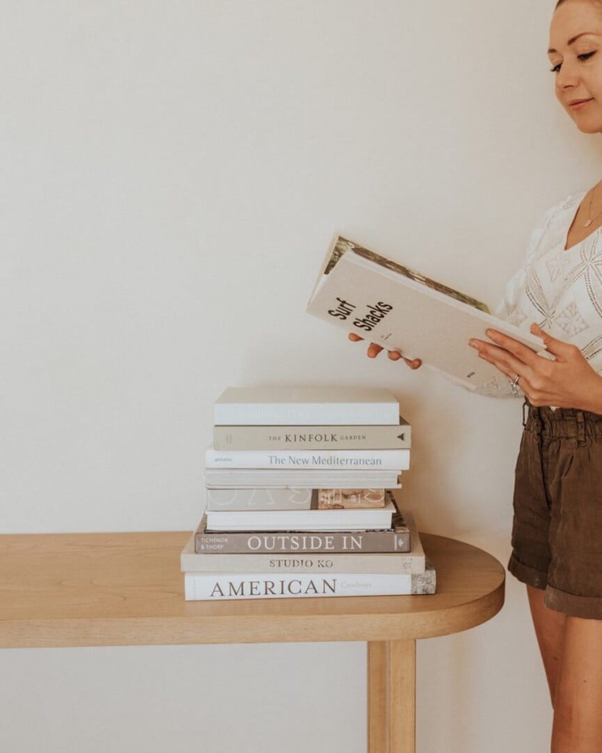 Woman reading beautiful cookbooks.
