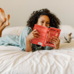 Woman reading bed.