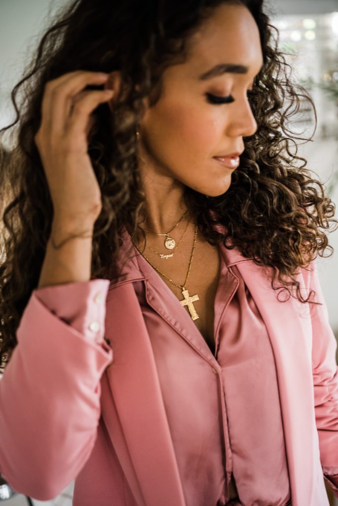 woman pushing hair behind ear