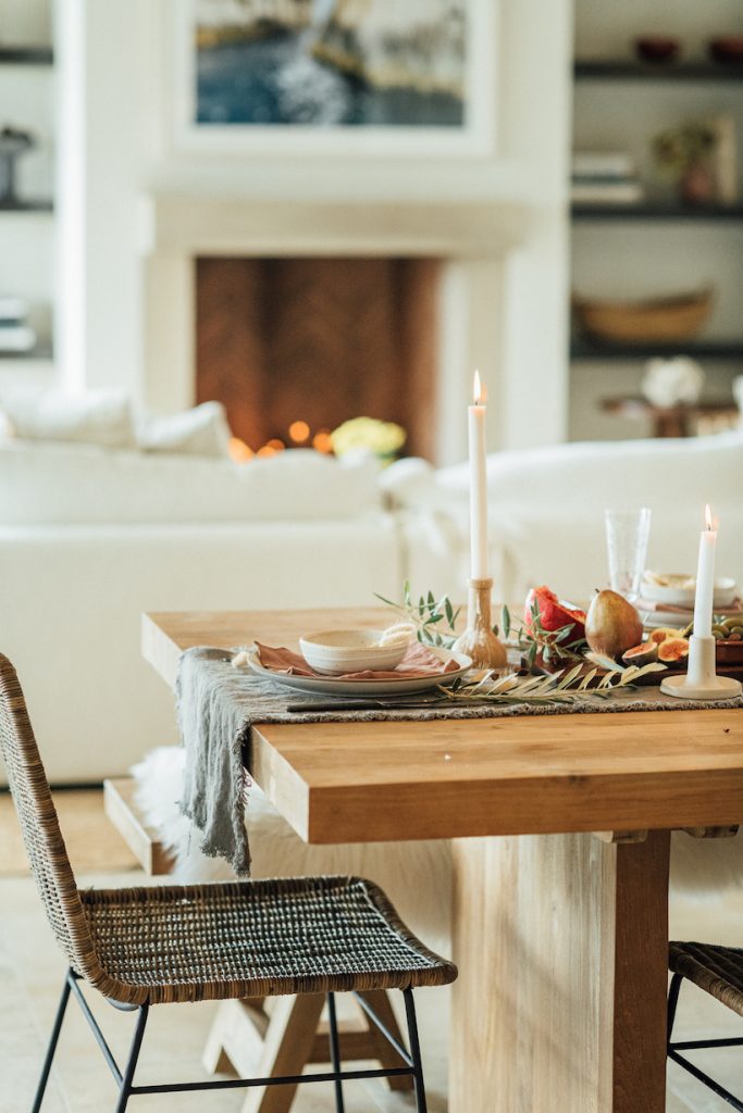 Dining table with woven chairs.