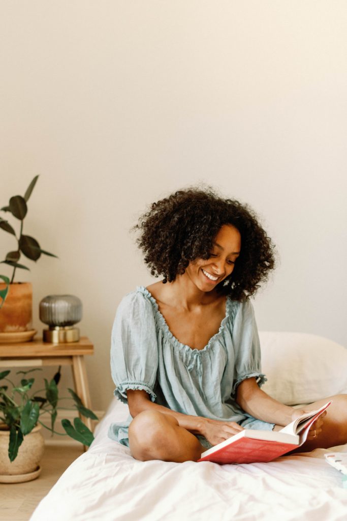 woman reading in bed new year intentions