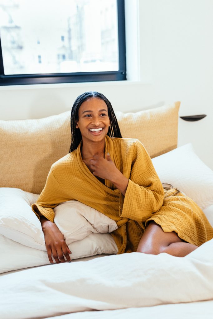 woman smiling wearing robe