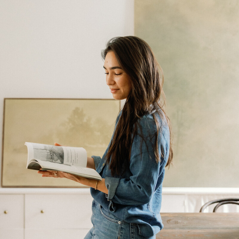 how to be creative - woman reading book in studio