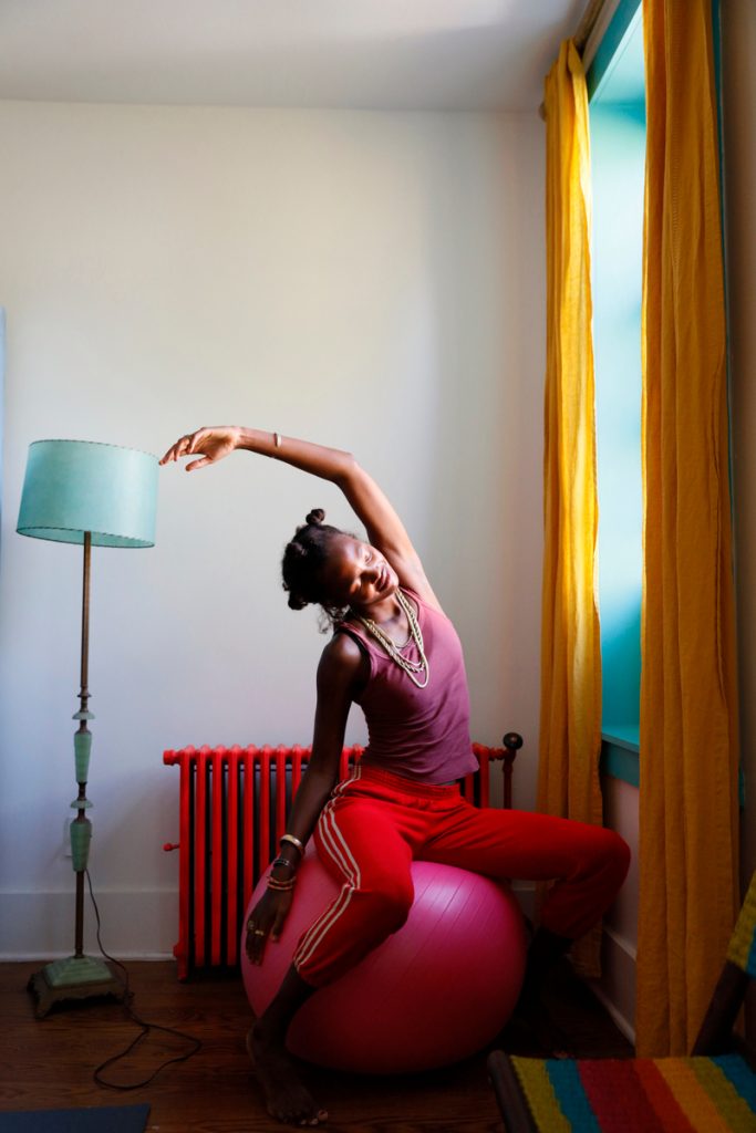 woman stretching on exercise ball how to reduce inflammation