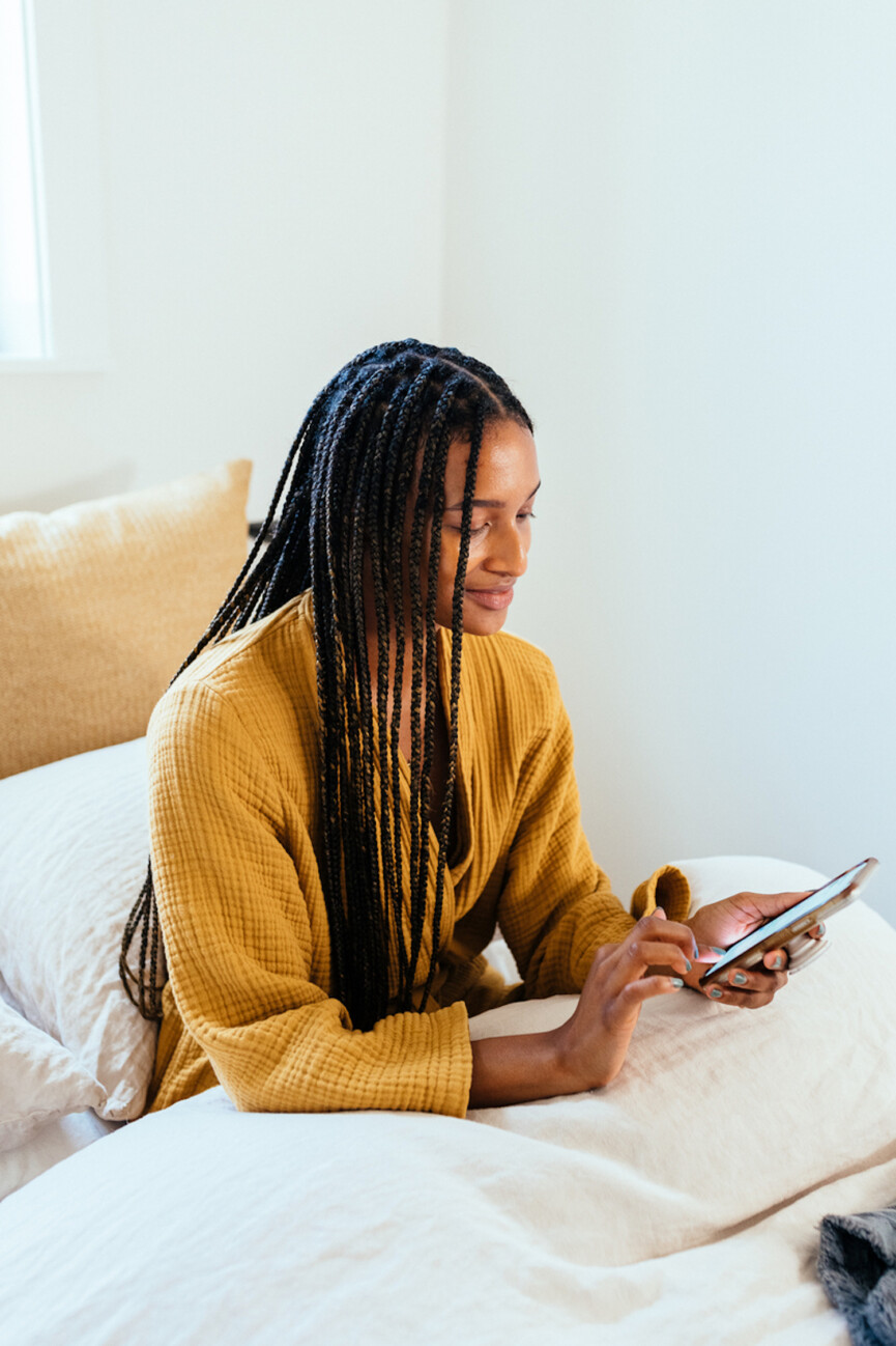Woman using phone.
