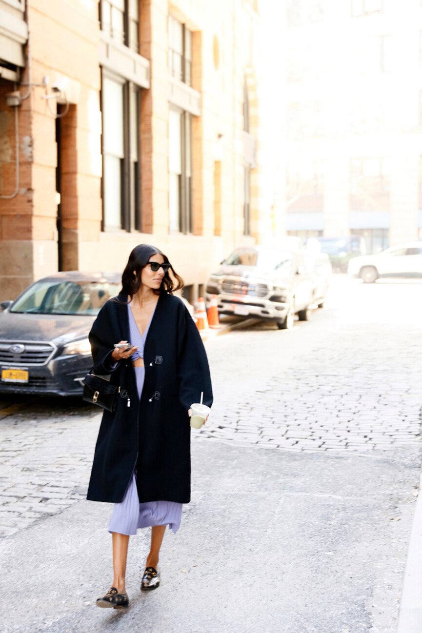 Woman walking in city.