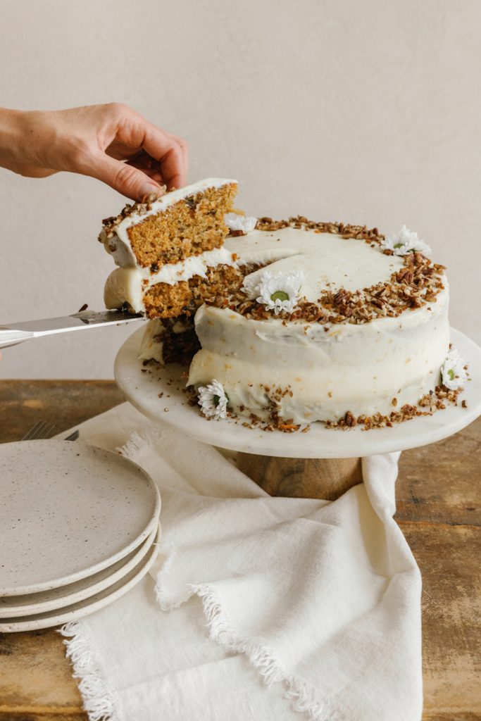 Cutting carrot cake.